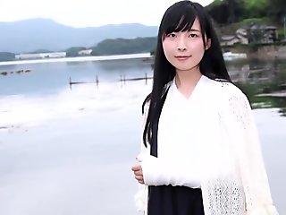 Japanese girl unwraps bandage from her injured ankle
